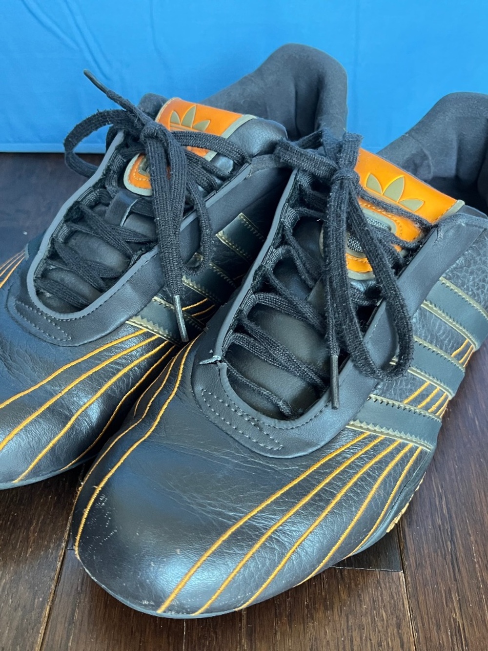 Used Men's Adidas Goodyear Brown Racing Sneakers Size 8. Fair Condition.
